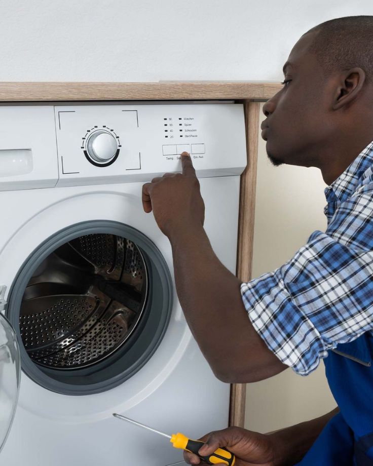 Cape Town fridge technician documenting diagnosis on-site