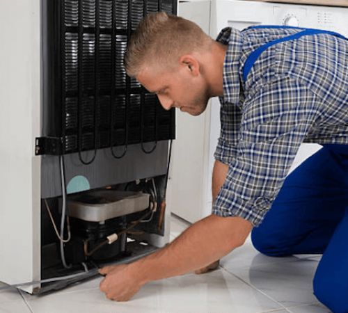 Cape Fridge Care technicians servicing a commercial display fridge in Cape Town